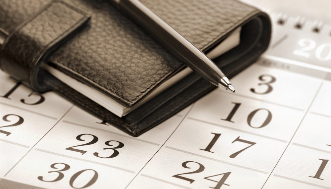 Calendar page, pen and pocket planner